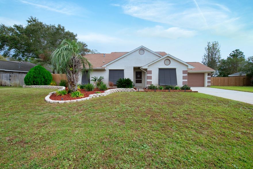 Quite possibly the most unique property to come to the Navarre marketplace in recent times, we are pleased to announce this 3 bed, 2 bath West Coast inspired beautiful home in Biscayne Pointe. Located on the soundside of 98, Biscayne pointe provides private access to the Navarre Sound. As you enter the home, you're greeted by large vaulted ceilings in both living room and kitchen, high end wood LVP flooring, fresh paint throughout the interior to include baseboards, LED lighting, and much more. The chef's kitchen features granite countertops, stainless appliances, bar seating, and a large area for formal dining. The master suite is extremely large, as is the ensuite. You'll enjoy personal touches in the bathroom to include shiplap, granite, and tile. Front and back yards are heavily manicured for pristine appearance. The backyard fence is brand new, and many trees were removed creating a flat, enjoyable relaxation space perfect for pets and privacy. The front yard features upscale landscaping, log pathway decor, and a complete exterior lighting sequence that will convey with the home. Other upgrades to the home include keypad locks for security, NEST thermostat, irrigation system upgraded, and will feature a transferable Terminix termite bond. This home is truly unique and will not last long, so consider booking your private showing today. 