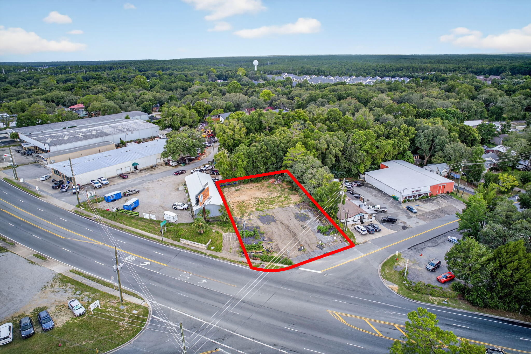 Vacant commercial land located in West Niceville at the corner of Government Avenue and Howell Road. Property is adjacent to Basil & Baxter's Restaurant. Property is zoned C-2 in Okaloosa County, which allows for most commercial uses. An existing Development Order is in place on this property to accommodate a 3,723 SF commercial building. See attachments for Site Plan. Property has excellent visibility with over 23,500 cars per day, per FDOT. This property was formerly developed as a Car Wash in the past.