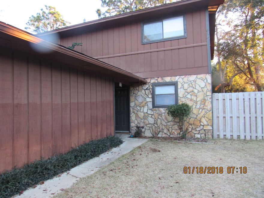 Large townhome in a semi-private location in Shalimar with large back deck! 3 bedroom unit with 2 and 1/2 baths and a one car garage and extra parking on the side. Lots of kitchen cabinets! Wood laminate floors in living room. Master bedroom has shower only and second bedroom has a balcony that looks over the backyard. The backyard is privacy fenced and has a large deck. Small pet upon approval of owner with restrictions. No smoking inside unit or garage. Showings begin on Feb. 4th.