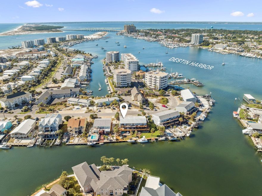 Nestled along the serene canals of Holiday Isle, this stunning three-story waterfront home offers the perfect blend of luxury, comfort, and the ultimate Destin lifestyle. Featuring 3 bedrooms, 3.5 bathrooms, and breathtaking harbor views from nearly every level, this residence captures coastal sophistication at its finest.The main level showcases an open-concept living area filled with natural light, complemented by a gourmet kitchen with high-end appliances, custom cabinetry, and a spacious island perfect for entertaining. Elegant finishes and a modern coastal design create a timeless atmosphere throughout the home. The primary suite offers a peaceful retreat with a private balcony, walk-in closet, and a spa-like bathroom featuring dual vanities, a soaking tub, and a separate shower. Each additional bedroom provides ample space, private baths, and beautiful views for family and guests alike.

Step outside to enjoy true waterfront living with two expansive balconies, a 30-foot private dock. Whether relaxing with morning coffee or taking in sunset views, every moment here feels like vacation.

Additional features include a garage, ample storage, and furnishings that convey, making this home completely move-in ready. Just minutes from Destin's white sand beaches, Harbor Boardwalk, fine dining, and world-class fishing, this property offers the perfect combination of tranquility and convenience.