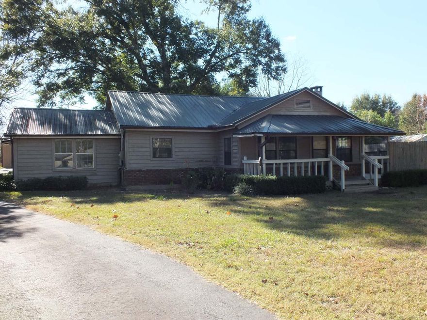 Where to begin talking about this unique mini-ranch close to Crestview. The main house has a cedar siding and covered front, side and rear porches. The immaculate interior has been freshly painted and features a large great room with wood burning fireplace, 3 bedrooms, 2 baths and a kitchen with adjacent dining area. A hidden feature is the ''safe basement'' living area, which can be accessed from inside and outside. It includes a living area, 2 bunk areas, a kitchen a full bath w/ independent power, water, septic, a/c , and dehumidification.  Outside is a screened pool, a koi pond, a garden building w/ fenced garden area, and a 2-car garage with a work shop and storage room. Solar and wind power create almost net metering. The old barn has 3 stalls. 2 separate pastures cover 3+ acres.