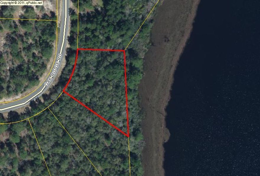 Check out this .93 acre waterfront lot on Juniper Lake! Lot is located in the north east section of Juniper lake that is less populated for more seclusion and privacy. This lot provides you with 270 Feet right on the water! Clear this property and build you a beautiful lake front home. Adjacent lot for sale as well. Purchase both for 2 Acres of waterfront Property!!!