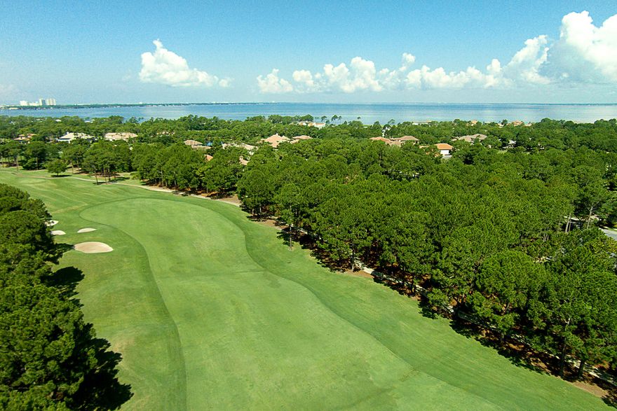 With a privileged location behind the gates of an exclusive country club community on the grounds of a renowned golf and beach resort, this nearly half acre lot down the street from the Burnt Pine Golf Club backs up to a manicured fairway of challenging Burnt Pine golf course. There is no build out time requirement in Burnt Pine, so lot owners may build at their leisure yet still enjoy all the perks of resort living. The Sandestin resort property offers amenities that include a tennis center, full-service marina, on-site dining, as well as beach access.