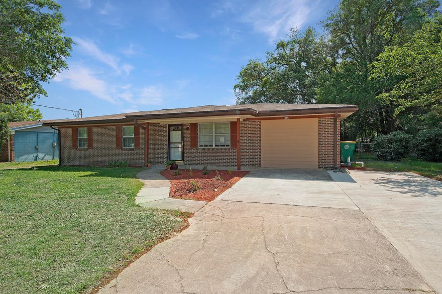4 Bed, 2.5 Bath All-Brick Shalimar Sanctuary.Approach your new home from your large, oversized driveway. Upon entering, stepping onto white oak wood floors, note the charming chair rail and fresh baseboard molding in the dining room as it transitions into the kitchen with granite-topped breakfast bar and granite countertops that contrast nicely with the new stark white cabinets and stainless steel appliances. A built-in butcher block is a perfect touch for the aspiring chef. Off of the kitchen is access to an oversized laundry room. Down the hall, on this side of the home, are three bedrooms (all bedrooms complete with ceiling fans) with a beautifully tiled full bath and granite-topped vanity. One bedroom features a walk-in closet and a bonus half bath that boasts an additional closet.