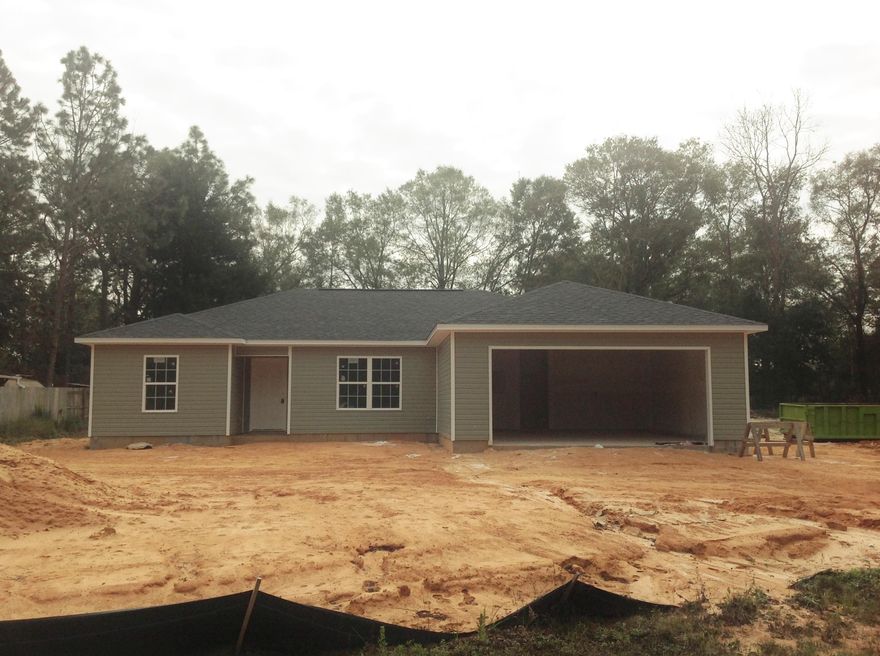 Brand NEW and ready to call HOME! This captivating 4 bedroom, 2 bath home with large, 2 car garage will steal your heart! Newly constructed by highly acclaimed, local builder, every detail has been attended to for its lucky first owner's! Foyer welcomes you into the vaulted ceiling in the living room. A bedroom/office is off to one side. The large kitchen features stainless steel on black, electric stove, microwave and dishwasher and sunny Dining area. Master bedroom has trey ceiling and Master bath features double vanities, walk in closet, wonderful garden, soaking tub and shower combo. Split bedroom plan offers privacy with 2 more bedrooms on opposite side with full bath and linen closet. Laundry room convenient from garage. HUGE backyard. Minutes to Historic Downtown Crestview & Bases!