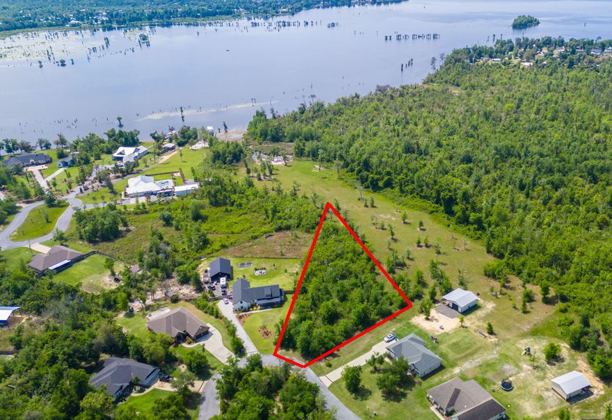 Get ready to build your dream home on this .94-ACRE homesite in the highly desirable, Cedar Creek community on Deer Point Lake!This homesite is high and dry, in zone X and an incredible opportunity to develop your own dream oasis. Envision living your best life with an expansive yard, detached garage for all the toys, a pool where the family can play year round and so much more!Cedar Creek is a master-planned community that harmoniously integrates with the natural landscape, preserving its tranquil surroundings for residents to enjoy for years to come. Known for its excellent fishing opportunities, Deer Point Lake is a haven for bream, shellcracker, and bass enthusiasts. Its proximity to Econfina Creek also offers easy access to the vibrant offerings of Panama City and the surrounding areas, all while enjoying the benefits of waterfront living.

Residents of Cedar Creek benefit from exceptional community amenities featuring a large community pool, playground, golf cart-friendly streets, and abundant greenspace, creating a country feel while remaining in a highly desirable location. Wildlife is abundant, enhancing the natural charm of the area. The community clubhouse is available at no cost to residents, making it an ideal venue for hosting events such as birthday parties and showers and family gatherings.

This is your chance to build your dream home!

Adjacent 5.5-ACRE waterfront homesite is also available. Please inquire for more information.