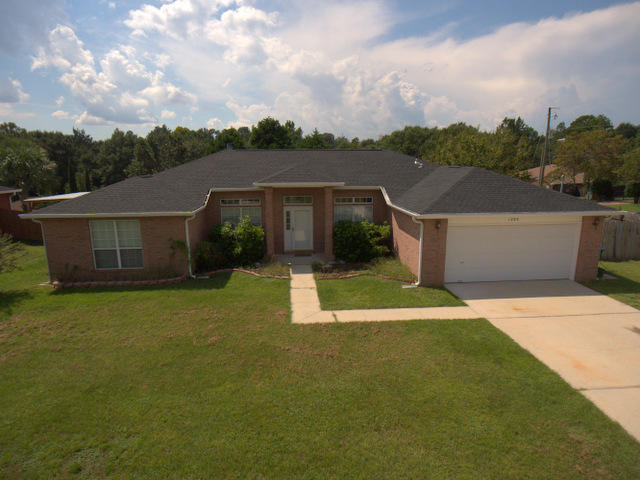 BRAND NEW ROOF AND TILED FLOORS!! All brick 4 bedroom home that also comes with a formal dining room and an office off of the foyer area. This great floor plan has the 4 bedrooms in a split bedroom floor plan with a master bedroom of 17x15. The master bathroom has dbl. vanity sinks, dbl. walk-in closets and a walk in shower separate from the soaking tub. The kitchen is large with a center work island a small cafe area in the corner, There is also a dining room off of the kitchen for larger gatherings. There is a pantry, plenty of cabinet space & work top space in the kitchen. The HVAC system in the home was replaced about 5 year ago with a Carrier system. There is a corner fireplace and French doors going out back to a large deck for grilling & entertaining. Back is privacy wood fenced.