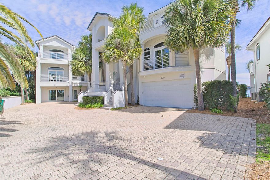 This exceedingly spacious lakefront home at 4659 Destiny Way is located in the beautiful exclusively gated 'Destiny' neighborhood, one of Destin's most exquisite residential enclaves. It encompasses 7,041 total square feet with 6 beautifully furnished bedrooms in the main residence and an additional 5 bedrooms with full ensuite baths in a Guest House. Close to Beach Access with Gulf Views!!!! The Infinity Pool/ Hot Tub is accompanied by an Outdoor Kitchen, Fireplace, & Full Bath.Besides serving as a Forever Home for big family beach vacations, this gracious, hospitable home has also been on a lucrative rental program as it can accommodate up to 34 fortunate guests and has parking for 12 cars. Gross annual rental income stands at $475,000 year-to-date bookings.