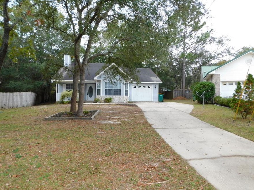 Great starter or investment property in the much higher priced neighborhood, of Pinnacle Point. This beauty has a brand new Dimensional roof installed December of 2019, a newer HVAC system and new flooring just put in. Located on a very large shaded lot at the end of the culdesac, this home has so much to offer and many opportunities. Located on the very south side of Crestview, this location makes for an easier commute to the bases and beaches along the Emerald Coast. This 3 bedroom home also a corner fireplace, vaulted and raised ceilings, a soaking tub and more. Call and take a closer look at this home before it is sold. The seller is even offering a one year home warranty at the time of closing for the extra piece of mind.Located in the county for lower property taxes.!