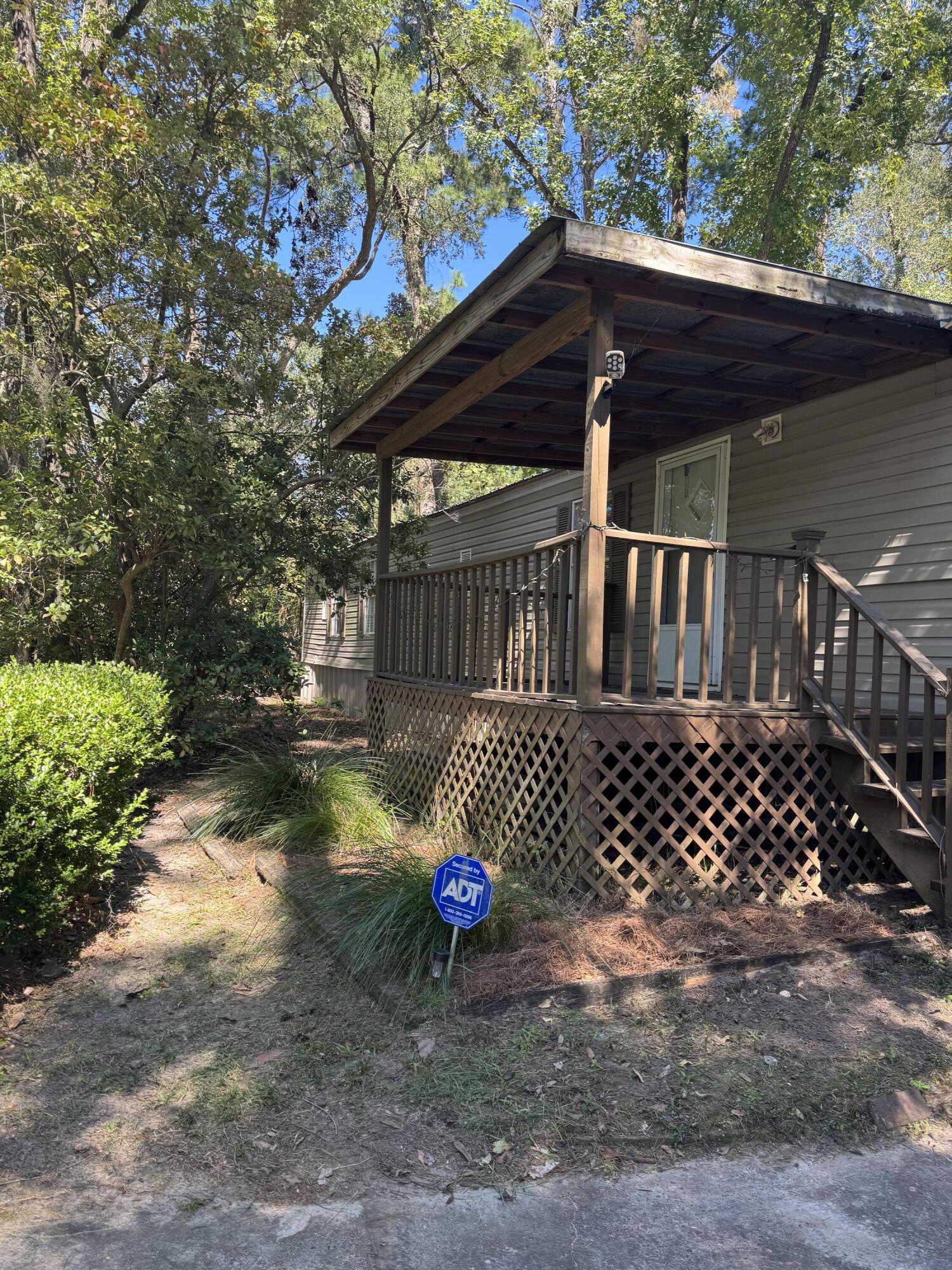 Don't miss this great opportunity to own a mobile home 4 miles from FSU in Tallahassee.  This open floor plan, split 2 bedroom home has more than meets the eye.  The primary bedroom is spacious with adjoining oversized bathroom which includes a garden tub.  There is a back deck that has a large storage shed (8'x12')  The possibilities abound.  The yard is natural and  low maintenance. Perfect for investment property.