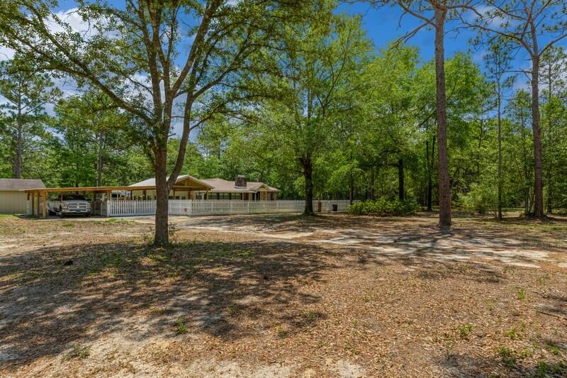 Renovated all brick home on secluded flat 10 acre lot! This beautifully renovated home rests on a peaceful 10 acre parcel and is ready for your family, pets, farm animals, RV, boat and more! You have the room to truly have it all on this expansive property. The home is newly renovated home has much to offer. Fresh paint throughout, LVP flooring throughout, shiplap walls, complete new kitchen with SS appliances, farmhouse sink, granite, island, cabinets, lighting and more. Enjoy the enlarged fully renovated bathroom with claw tub, separate shower, granite double vanity, linen cabinetry and tile accent wall. Massive master bedroom with beamed ceiling and closet with French doors leading out to a screen in porch, perfect for enjoying a cup of coffee in the morning.