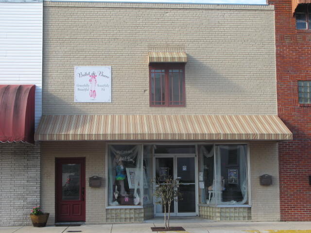 2nd floor office directly across the street from the Courthouse. Has 4 private offices, 2 large rooms, kitchen, storage room, and 1 restroom with shower. Front and rear entrances by stairs. Tenant will pay $99 for water and sewer.