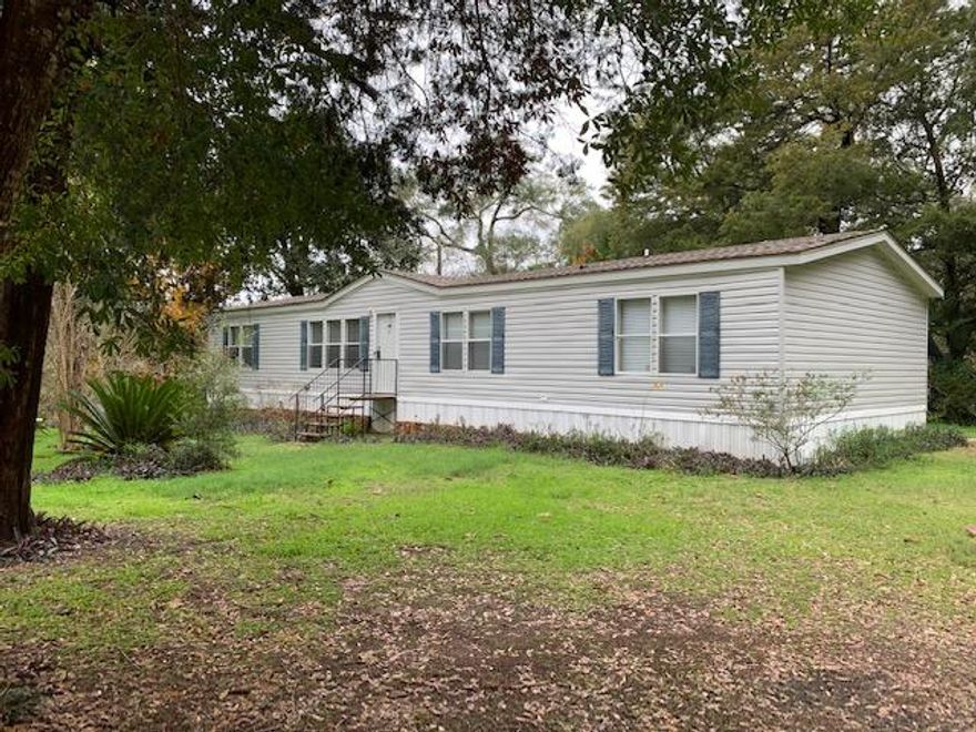 Want a country feel but still close to area amenities? Take a look at this 4/2 mobile home on a beautiful shaded lot in the Choctaw Beach area. This home offers two living areas, spacious kitchen, separate laundry room and split floor plan. Corner lot is level and loaded with beautiful shade trees. There is even an added storage shed for all your gardening tools. Home is in great condition and just waiting for you. Home being sold 'as is'. Buyer to verify anything deemed important including, but not limited to, lot size, room dimensions, sq/ft.