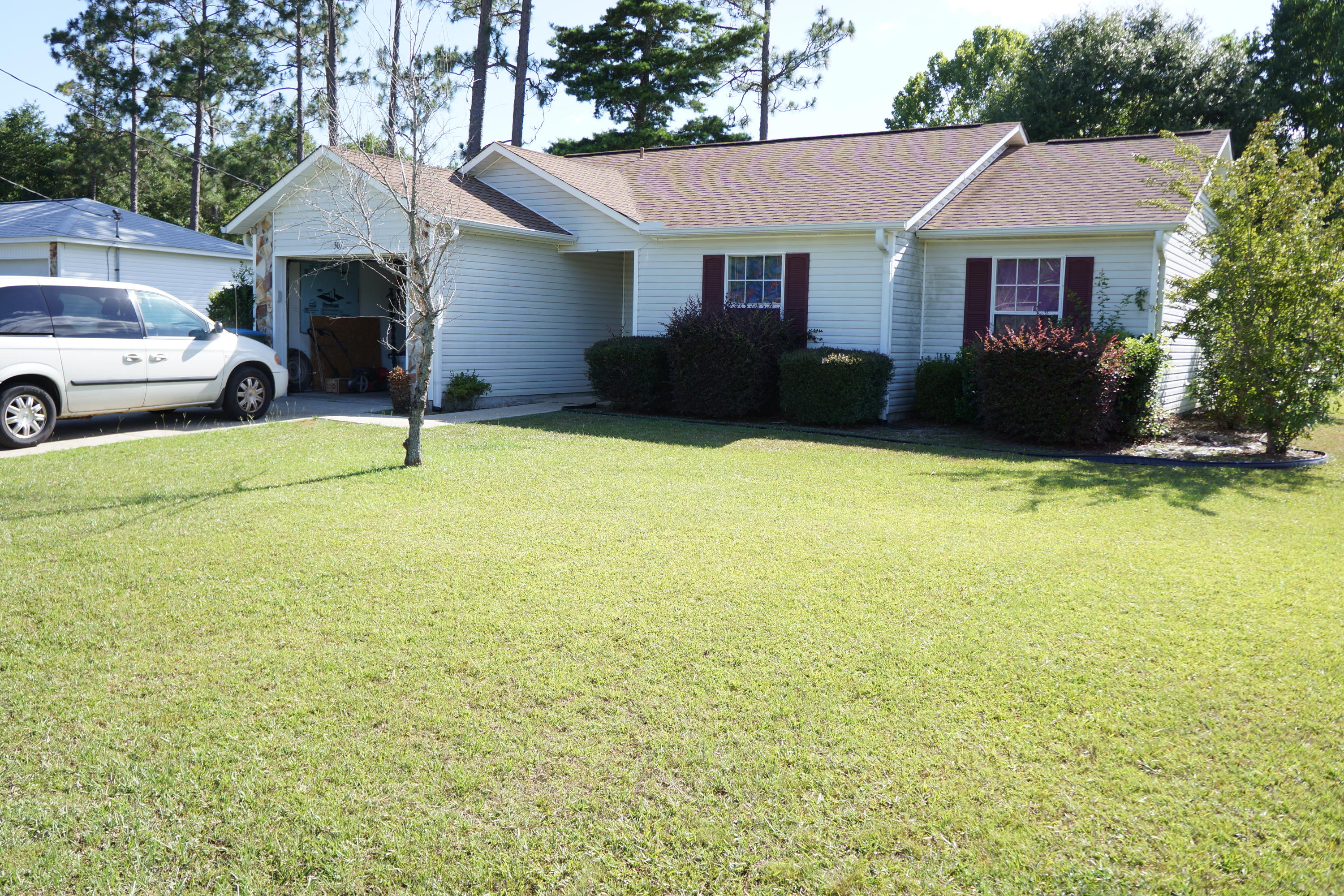 Nice 3 bedroom 2 bath home with vinyl siding is a great investment opportunity or starter home. The living room has vaulted ceiling with plant ledge and is open to the sunny dining area with bay windows. The kitchen has nice oak cabinets, all appliances and pantry. The privacy fenced back yard is large and level with nice shade trees. Call today to schedule your appointment to see this home.
