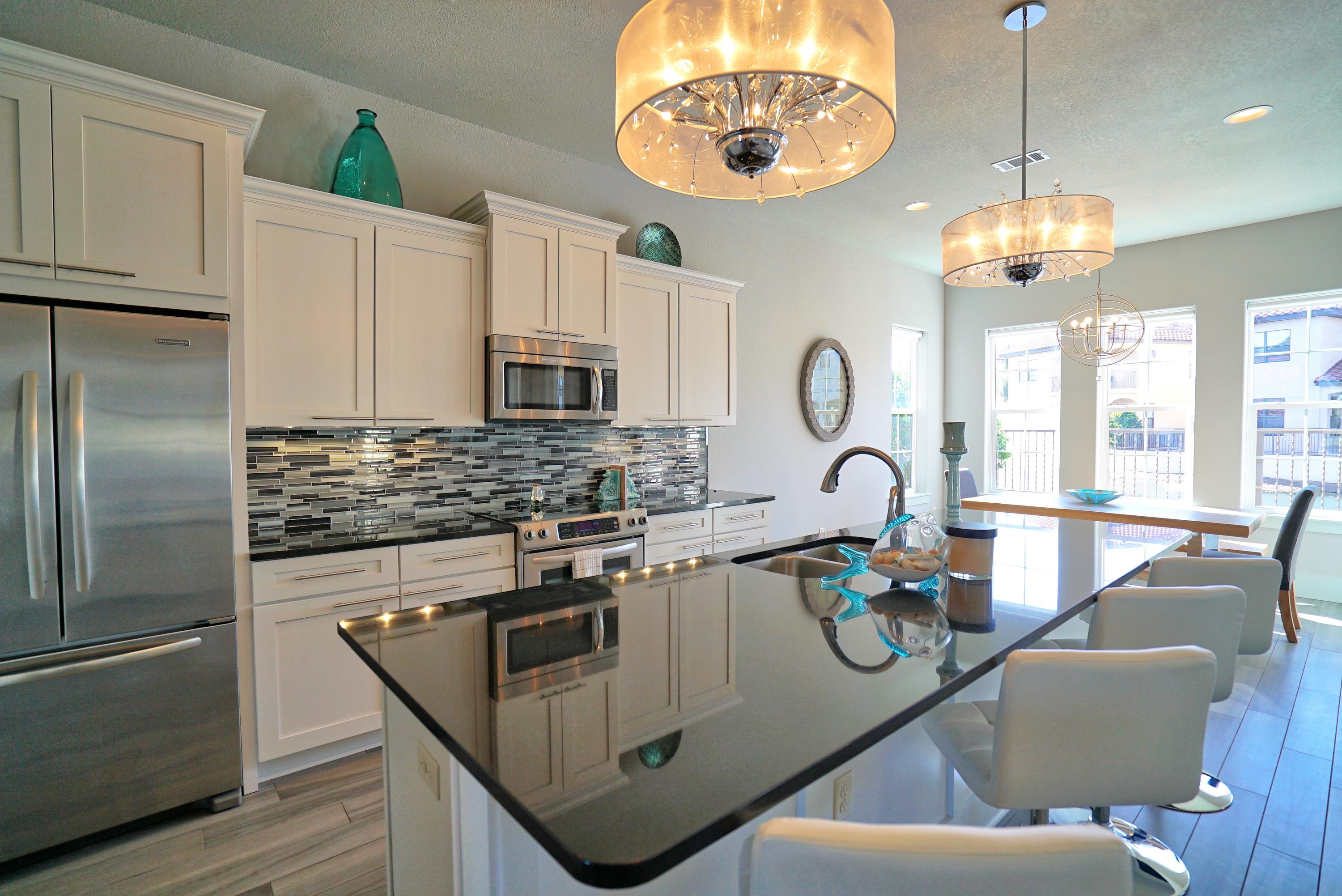 The emmaculate attention to detail throughout this Lakeside Villa is a must see. Simply move in and not change a thing. Gorgeous finishings, a top level eye for design, and an extra large Master bedroom put similar properties in the neighborhood to shame. Furniture included. Like-new 6 seater golf cart included. Stainless Steel Appliances. Community Pool. Lakeside Lot with relaxing water views from your porch swing. Community has 4 Golf Courses, 15 Tennis Courts, Restaurants, Bars, Wine Festivals, Marina, Shopping, Beach Access, Arcade, Laser Tag, Rock Wall, Zip Line, Rope Course, Playgrounds, and Spa.