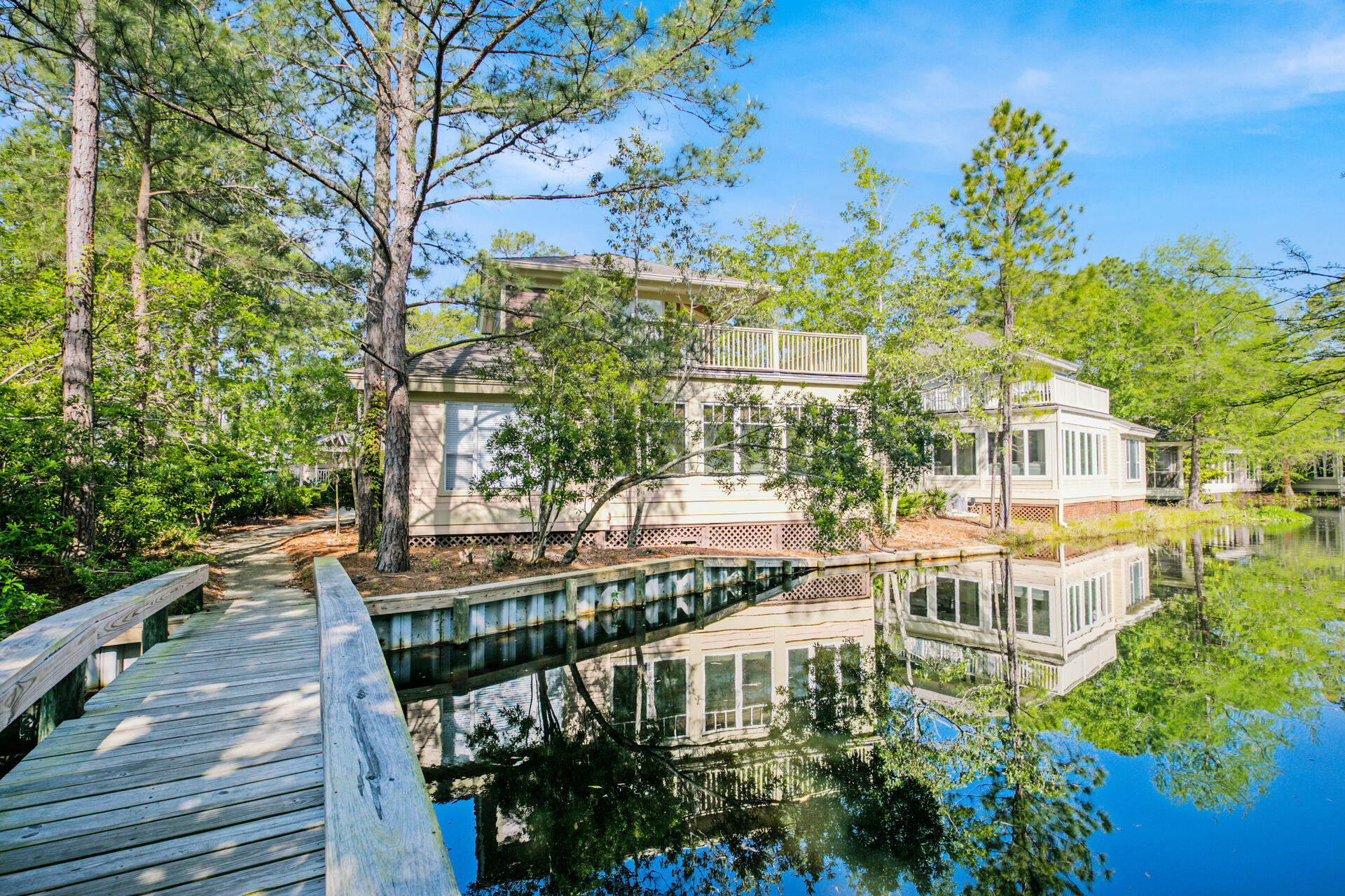 Never been on a Rental Program, with enclosed heated and cooled lanai adds more than 200 sq. ft. of added living space fronting the lake. Baypine cottage has been well-maintained one owner home being offered COMPLETELY furnished and move in ready! Positioned in close proximity to the new aquatic center, tennis courts, marina and Village at Baytowne Wharf, this resort retreat is perfect for primary living or a vacation rental in a desirable neighborhood.