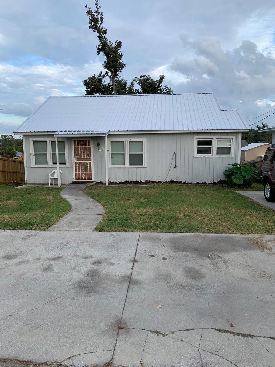 Are you ready to take this house in the Cove and make it your own?  This fixer upper features 2 bedrooms and 1 bath with a basement below and a deck in the back.  The property can also be accessed from the back alley access.  It convenient to Downtown, Panama City Beach, and Tyndall Air Force Base.  Don't miss this opportunity!Clarification:  The property only has 2 bedrooms and 1 bath.  There is a toilet in the basement, but it is not counted as a bath because is does not have a sink nor a bath to go with it.