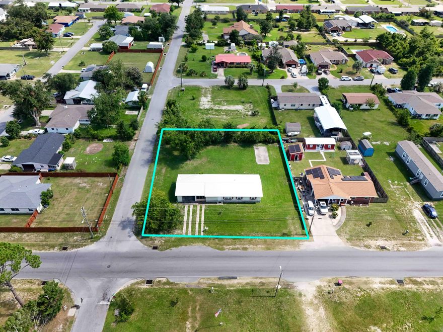 CURRENTLY UNDER CONTRACT, SELLER WILL CONSIDER BACKUP OFFERSLarge Versatile Corner Lot! This property truly stands out with its mixed-use zoning, offering a wealth of possibilities. You could easily continue using it as a spacious residence or transform it into a strategic office space; it's also suitable for further development. Whether you envision establishing a home-based business, a small commercial venture, or even redeveloping the area, this property aligns perfectly with the thriving growth of the surrounding community. At its core, you have a sizable 3-bedroom, 1-bathroom home with practical features such as a functional kitchen with breakfast area, an inside laundry room, a welcoming and generous size family room complete with a cozy fireplace and an added man-cave that creates  dedicated workspace or hobby area. Outside, the property is amplified by an expansive corner lotjust under half an acreat your disposal, boasting a generous carport providing ample space for multiple vehicles; it speaks versatility. While the roof was replaced in 2019, please note there is still some remaining damage from Hurricane Michael. Capitalize on this great deal and explore the myriad possibilities this unique property offers! (all sizes approximate and taken from public records, buyer to verify any details buyer deems important).