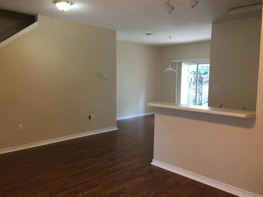 Well maintained townhome right in the heart of Destin in the Magnolia Park neighborhood. The downstairs has hardwood floors in the family room and dining area. Tile in the kitchen and bathrooms. Half bath and laundry downstairs. The glass sliding doors open to a private patio and fenced back yard. Carpeted bedrooms upstairs are good size and each has their own bathroom and walk-in closet. This home also has a 1 car garage