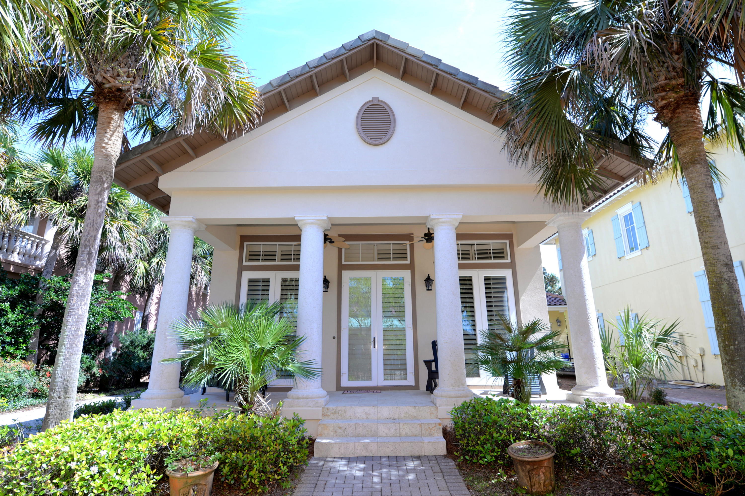 CHARM GALORE ALL NEW HARD STUCCO AS OF FEBRUARY 2019! Charming Caribbean home in beautiful gated Caribe neighborhood. Ideal floor plan with master suite down. Doors from master bedroom lead to a private back yard garden area. A nice shed for yard equipment, etc. is also located in the back side yard. The first floor houses the living/dining area, kitchen, half bath, laundry room, & master suite. Upstairs there are two bedrooms & a guest bath. Each guest bedroom has a small balcony. Other amenities include plantation shutters, crown molding, raised ceilings, & fireplace in the living room. The house is located on the northeast side of the cove on Rue Martine. Caribe is a private guard gated gulf-front community with two neighborhood pools, tennis courts, a large lake with