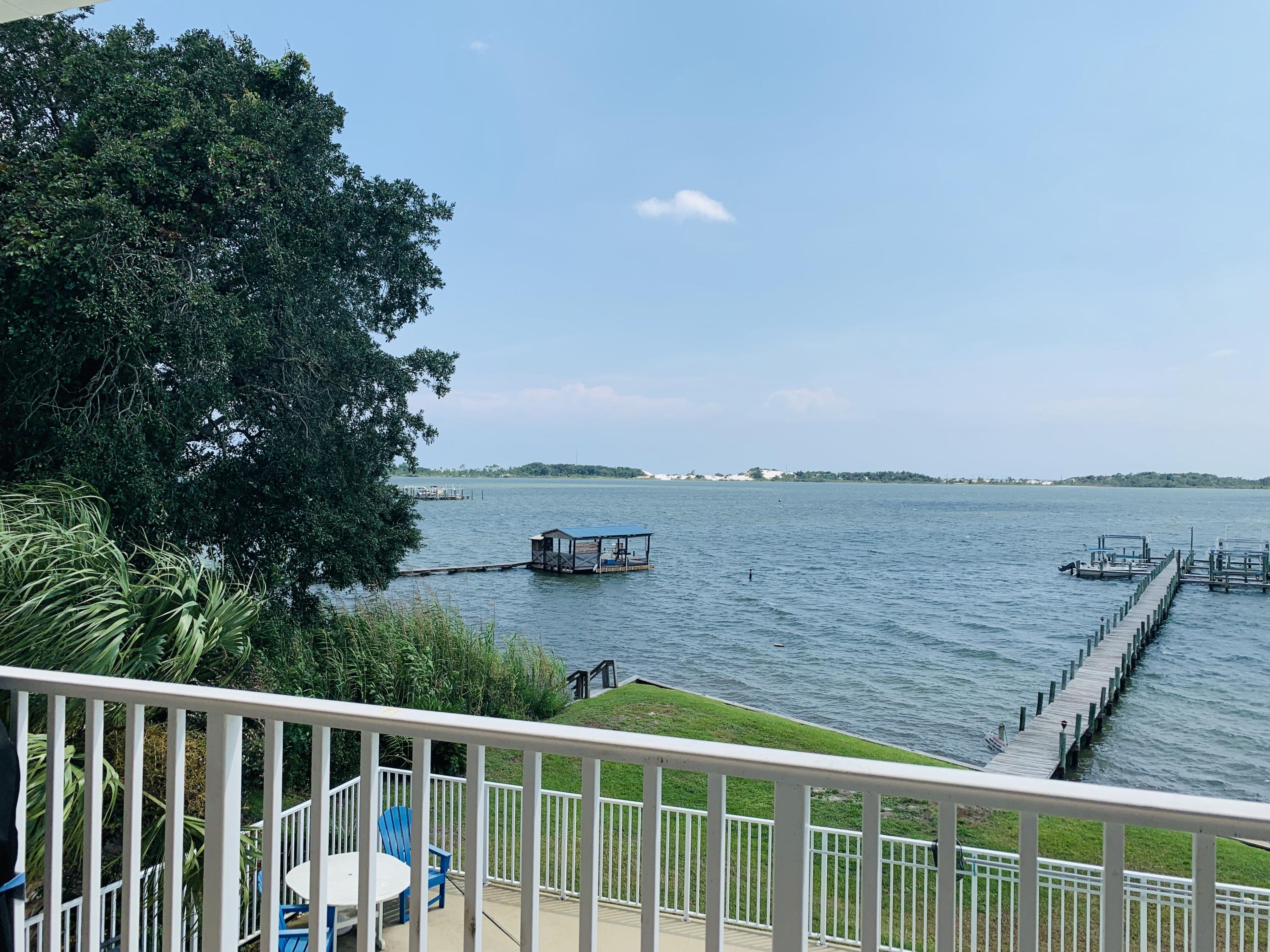We will accept backup offers! This is a beautiful waterfront, 3 bedroom condo that comes with a deeded boat slip and boat lift (electric)! This lovely floor plan offers amazing water views from the kitchen and living area. The living area has beautiful wood plank tile and the bedrooms have carpet. You will be pleasantly surprised by the amount of storage in this unit! However, don't worry about needing more storage because you will also find a large exterior storage room next to the covered parking space that is assigned to this unit. This truly is an amazing condo that is located just a short few minutes from Hurlburt Field, shopping, beaches, and hospitals. A bonus perk...this property is VA approved! Schedule your showing today! Agent is in process of verifying info.
