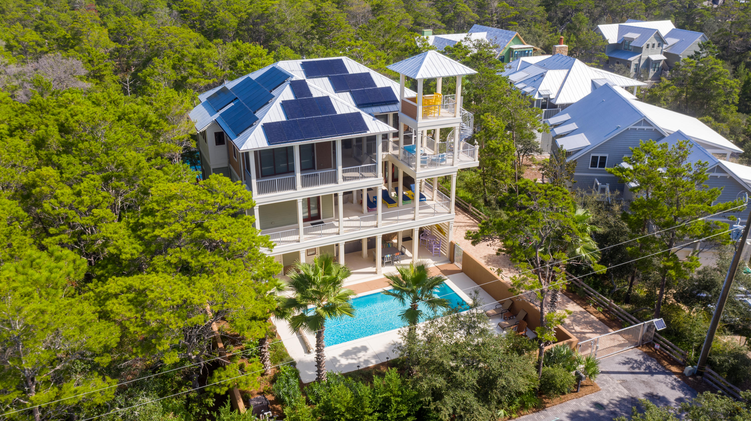 Looking for an owner who appreciates quality and an environmentally friendly home. This sophisticated 'green built' home was built with high quality ICF concrete construction and high impact windows, solar panels, and designer finishes. Outdoor kitchen around the pool area with mature landscaping and a gas fire pit are just the beginning. First floor bedroom currently being used as a home gym. Take the home elevator up to the bedrooms and laundry room on the second floor with hot tub off of the Master bedroom and sunning decks. Top floor is a large open concept joining all into the space of the kitchen and living areas where entertaining is a breeze. The tower provides killer views of Draper Lake & the Gulf of Mexico.