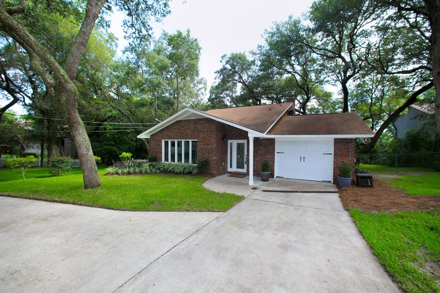 Major Price Reduction for quick sale! Welcome to this Waterfront Collection residence with tranquil views of Chula Vista Bayou ideally located within the desirable community of Kenwood. Residing on a private street surrounded with mature oaks, this split-level residence rests on approximately a third-acre with 69 feet of refined bayou-frontage. Recently having undergone a major renovation, this open floor-plan concept is fitting for entertaining. Notable features include new energy-efficient windows and glass sliding doors, ceramic tiles across the main level with high-end carpet located on the second level, custom lighting, trim work and fresh paint throughout, all new electrical wiring