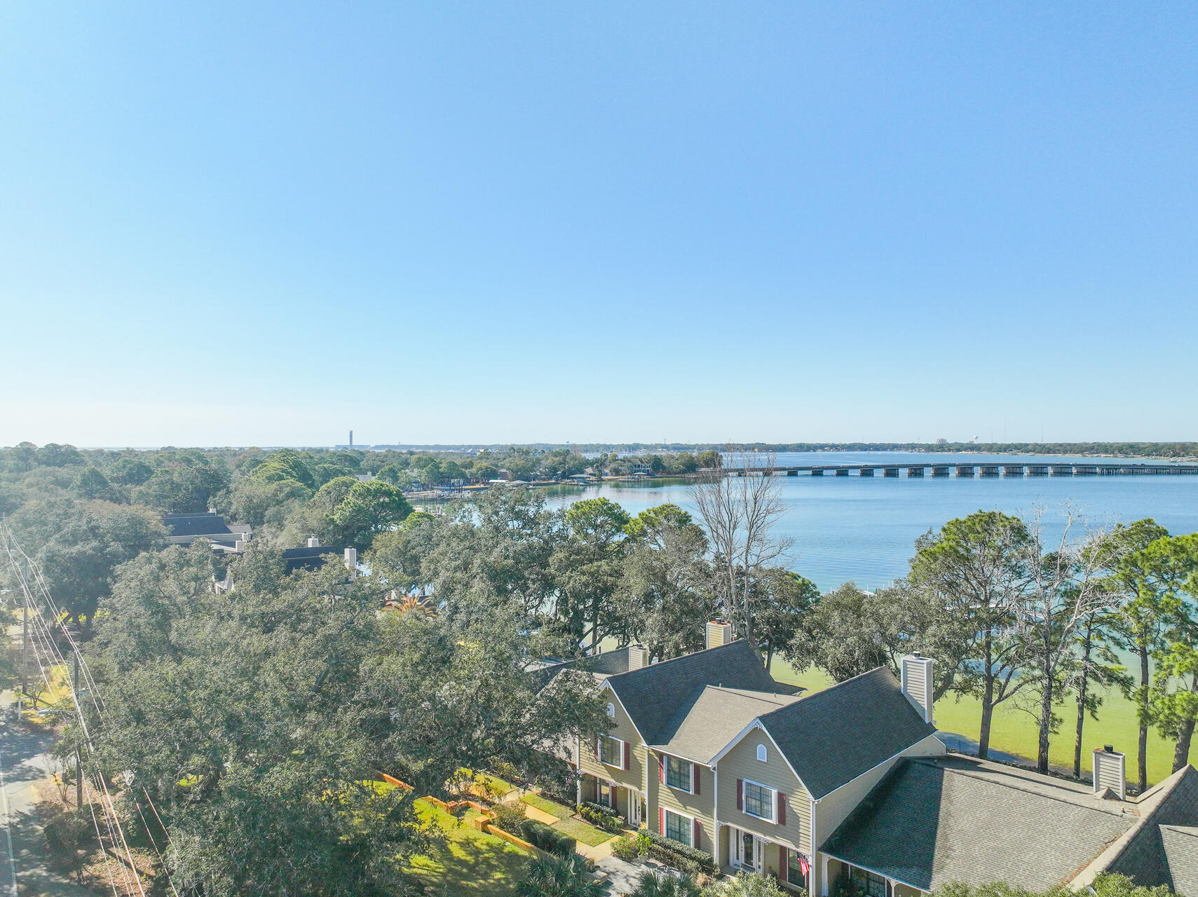 VERY RARE FIND! Waterfront 2 bed T/H end unit w/ 2 boat slips and private garage! Indulge in the pinnacle of luxury waterfront living with this prestigious end-unit townhome, complete with a private garage and two exclusive boat slips. The grand living room, highlighted by a stately gas fireplace, opens to sweeping panoramic views of the serene bayou, offering a front-row seat to spectacular sunsets. The master suite exudes elegance, featuring expansive space and tranquil bayou vistas. Step onto the expansive wraparound porch with a charming pavilion, then meander across the meticulously manicured lawn to your private beach. Two deeded deep-water boat slips, equipped with electricity, water, and a fishing bench, offer effortless access to the crystal-clear waters of the Emerald Coast. Nestled along the peaceful Cinco Bayou in Shalimar, Florida, this stunning home offers the ultimate blend of waterfront living and proximity to EVERYTHING NEAR BY! Take your boat to Crab Island 
and to Destin's world-renowned beaches. Step out your door and hop on your boat for a short ride to the Gulf of Mexico or explore the tranquil bay. Whether you're fishing the bayou, enjoying the breeze, or simply relaxing on your private boat slips, every day feels like a vacation. The leisure lifestyle awaits with endless opportunities for outdoor activities, breathtaking views, and easy access to all the charm and excitement. Make this serene coastal haven your home!