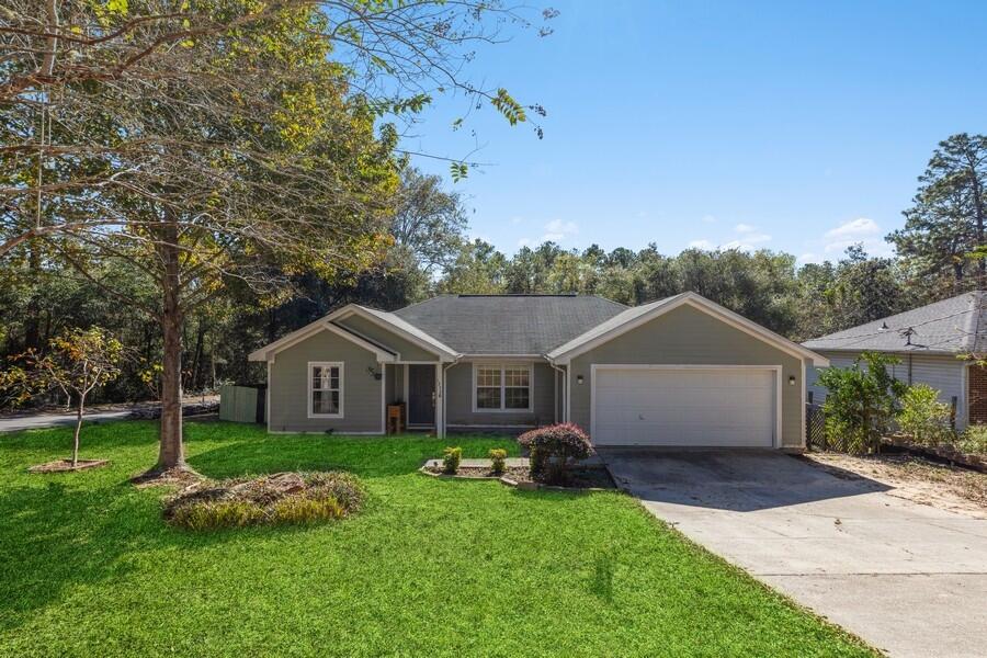This inviting Crestview home is ready for a new owner! As soon as you step through the front door you'll appreciate the spacious, remodeled living area. The open concept features vaulted ceilings, engineered hardwood and LVP flooring, stainless steel appliances, fresh paint, split floor plan, and a new water heater. The beautiful primary bedroom has a tray ceiling, walk-in closet, and ensuite bath with double vanity. The large bonus room could be an office, craft room, den, whatever suits you! The home's exterior has fiber cement siding and a 2-car garage. Situated on a large corner lot with several mature trees, privacy fencing, and a custom iron gate to provide backyard access for parking your boat, camper, etc. No HOA. Plus it's less than 10 minutes to Wal-Mart, dining, medical, & I-10.