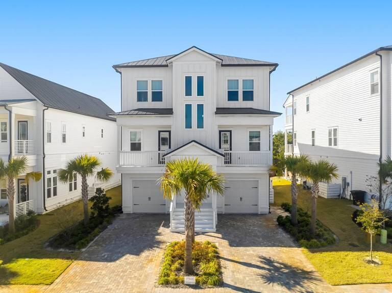 Coastal Elegance Awaits: Your Dream Home on 30A!Experience the ultimate beach lifestyle in this stunning residence located in the coveted Bluewater Landing community. Nestled in the heart of Blue Mountain Beach and South of 30A, this exquisite home is not just a primary residence. Blue Maven also serves as a perfect secondary getaway or a lucrative rental investment.As you enter the ground level, you have a flex room, which is currently used as a bunk room for multigenerational families to enjoy with games, media center, and an en suite bath. Step outside into the outdoor oasis featuring a fire pit and multiple seating areas with a private fence backyard with room for a dipping pool. Pop into the elevator are you are greeted by a chef's kitchen featuring stainless steel KitchenAid appliances, quartzite countertops, an oversized, breakfast bar, porcelain oversize Farm sink, and additional space for guests gathering and entertaining in the living room.
The second level also features a private dining area adorned with a charming Juliet balcony, perfect for intimate meals and morning coffee. The second en suite king bedroom with 12 foot ceilings is just off of the living room room with stunning forest views.
Ascend to the third floor, where floor-to-ceiling windows invite an abundance of natural light, creating a warm and inviting atmosphere. This level boasts three generously-sized bedrooms, including a secondary primary suite that is nothing short of a sanctuary. The lavish en-suite bathroom features a breathtaking porcelain tile shower, complete with three shower heads and an impressive seven feet of porcelain tile, ensuring a spa-like experience in the comfort of your own home.
For outdoor enjoyment discover a third screened-in balcony off the primary suite, where you can unwind while enjoying serene views of the surrounding forest and gentle Gulf breezes. This tranquil retreat is the perfect spot to relax after a day of beachside adventures.
Bluewater Landing is a gated community of only 31 homes, providing an intimate and secure environment. With unparalleled walkability, you can easily stroll to your favorite coffee shop or indulge in a meal at Mimo's Italian fine dining restaurant, all within a five-minute walk. For beach lovers, the beautiful Blue Mountain Beach Access is just a short golf cart ride away, allowing you to soak up the sun and surf in no time.
Whether you envision this stunning home as your primary residence, a vacation retreat, or an investment property, it perfectly captures the essence of coastal living. Embrace the lifestyle you've always dreamed of and make this elegant beach home your own.
All furnishings to convey. Upgrades include: solar panels, granite garage floors, light fixtures, furnishings, window treatments, fire pit, fenced back yard, screened porches, smart lighting system, and granite back porch application.