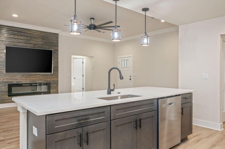 Swipe Right on this house!  Closing cost help available. This new construction home is perfect if space, quality & upgrades is your thing! The rooms are a decent size & the closets too. There is a formal dining room area & a large quartz island. The builder added crown molding for drama! The front & back porches are covered; backyard is huge & privacy fence is already up! Perfect, right!The Builder went ahead & threw in all of the appliances such as the washer, dryer, fridge, microwave, oven, 75-inch TV & electric fireplace!Your new home is less than a mile from downtown Crestview (food tucks, events, shopping. restaurants), only 8 from Dukefield, 20 from Eglin AFB, & more! It's also within district for highly rated schools. There's only 1 thing missing, YOU!! Professional Photos Coming Soon!