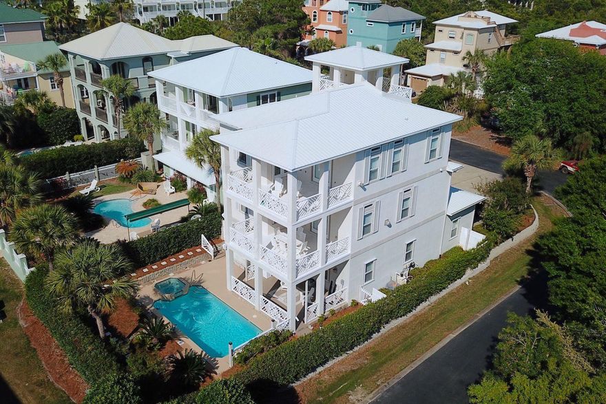 This spacious beach home is tucked away in the gated community of Caribbean Sunrise and is a short distance from the public beach access at the end of South Spooky Lane. The 3,330 square feet home provides ample opportunity to relax outdoors, with balconies on each of its three floors as well as a covered rooftop deck with a spectacular Gulf view. This grand, six-bedroom home offers a spacious floor plan with travertine flooring throughout, stainless steel appliances and granite countertops in the kitchen, and two master suites with large walk-in closets. Other features include an elevator as well as a private pool and close proximity to several 30A hotspots and amenities.