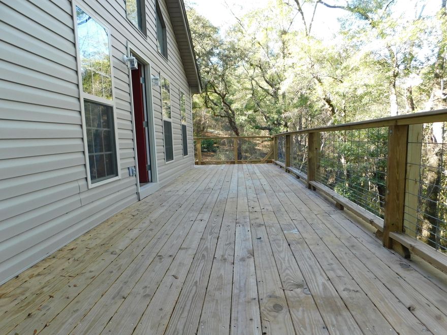 Experience the seamless transition from the outdoors to a newly renovated Florida Cottage simply by traveling on your new Property. This 1.4 acre property is gently covered with trees and at the backside of the property is a pond fed stream.  Once on the Brand New Deck if needing a quick rinse off from outdoor activities the outside shower will accomplish just that.  Upon entering the Home the New theme begins; New Appliances, New water heater, New windows, New kitchen cabinets, New flooring and much more.  The exterior has been refreshed as well starting with New Vinyl wrapped in tyvek. Also, there was a new well pump intstalled for the private well.  Waste no more time and schedule your showing today.
