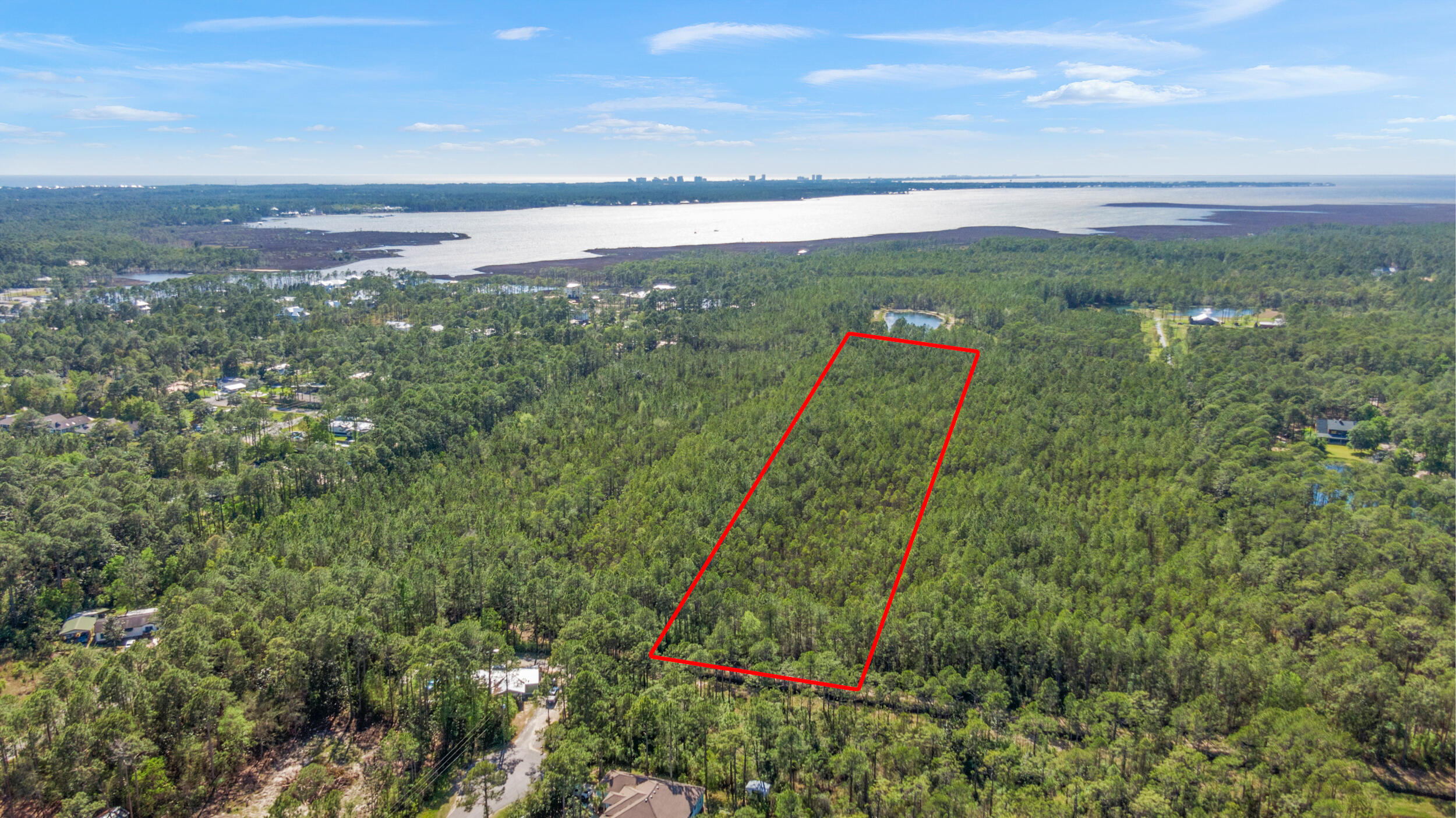 Attention Investors! Expansive 9.75 acre parcel of wooded land with a 30 acre potential! 3/4 of a mile from the Choctawhachee Bay. *Additional 20 acres also for sale to the north (listed separately for 30 acre potential!)* located close to a public boat access at the end of 393N and 1/2 mile from a public boat launch at Cessna landing on Hogtown Bayou. Just a few minutes to Hwy 98. Super convenient to shopping, popular local restaurants and the beautiful emerald green waters and white sand beaches of 30a. Excellent opportunity for development in a great location of South Walton.Buyer to verify lot dimensions, restrictions, utilities and zoning requirements.