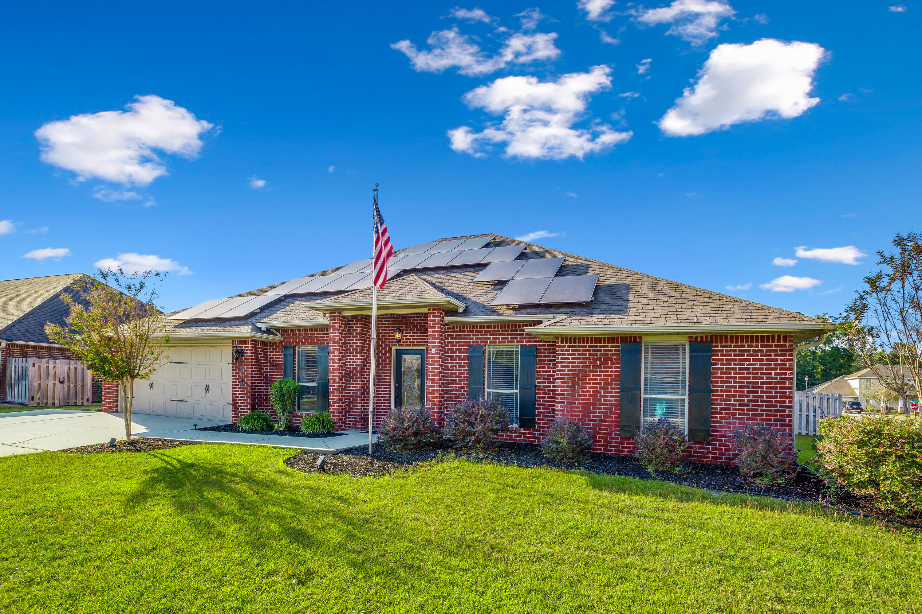 If you're looking for a home in the southernmost Crestview neighborhood, this brick 5 bed/3 bath is it! **2.75% VA Assumable Loan!** This house has been equipped w/Lumio solar panels prepared to power a household of 6 at 70 degrees and all their devices for a $25 monthly connection fee to FPL & the rest covered by the oversized system (oversized so as panels naturally degrade, it will still supply ALL the power required)! Open the door to high ceilings in the main living areas! The spacious formal dining room leads to the kitchen featuring a stunning custom wood island, granite counters, walk-in pantry, breakfast bar & pendant lighting! The split floorplan provides privacy for the master suite & includes a walk-in closet, bathroom w/dual-sinks, vanity & 'wet area' separate shower & garden tub! Upstairs is an extra-large bonus room w/built-in bookcase! Out back you'll find a gazebo in the fenced backyard w/sprinkler system! Schedule to see this home today!