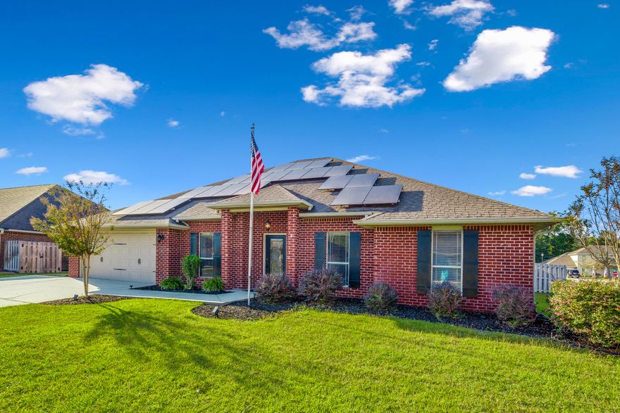 If you're looking for a home in the southernmost Crestview neighborhood, this brick 5 bed/3 bath is it! **2.75% VA Assumable Loan!** This house has been equipped w/Lumio solar panels prepared to power a household of 6 at 70 degrees and all their devices for a $25 monthly connection fee to FPL & the rest covered by the oversized system (oversized so as panels naturally degrade, it will still supply ALL the power required)! Open the door to high ceilings in the main living areas! The spacious formal dining room leads to the kitchen featuring a stunning custom wood island, granite counters, walk-in pantry, breakfast bar & pendant lighting! The split floorplan provides privacy for the master suite & includes a walk-in closet, bathroom w/dual-sinks, vanity & 'wet area' separate shower & garden tub! Upstairs is an extra-large bonus room w/built-in bookcase! Out back you'll find a gazebo in the fenced backyard w/sprinkler system! Schedule to see this home today!