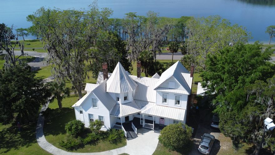 A stunning Victorian residence nestled on the shores of beautiful Lake Jackson, Alabama's only natural lake.The Residence:Grand 7-bedroom, 5-bathroom Victorian home, built in 1900, exuding elegance and charm. This home comes fully furnished.Perfect for a large family or potential for a bed and breakfast. The possibilities are endless.Spacious rooms with high ceilings, hardwood floors, and beautiful architectural details.Scenic views of Lake Jackson from many rooms.Large, inviting kitchen perfect for entertaining.Relax on the porch or expansive deck overlooking the lake.