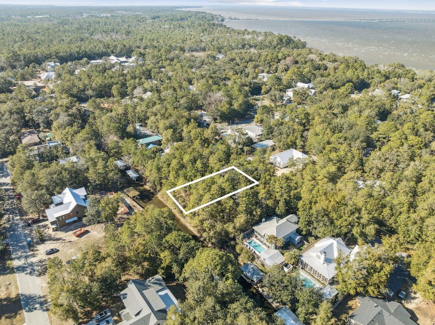 This is your chance to be on the water in Point Washington!  This beautiful 75 X 150 lot sits on one of two canals that filters into the Choctawhatchee Bay.  Your backyard is your gateway to enjoy boating, paddleboarding, kayaking and fishing. You are an easy boat ride away from multiple restaurants both on the south and north side of the bay. The famous white sand beaches of South Walton are also just minutes away from this homesite. You are close to 30A and all its attractions, but tucked away in private Point Washington. The lot size should accommodate a variety of uses from spacious homes to weekend getaway cabins. Visit the lot and start planning your new life on the water.