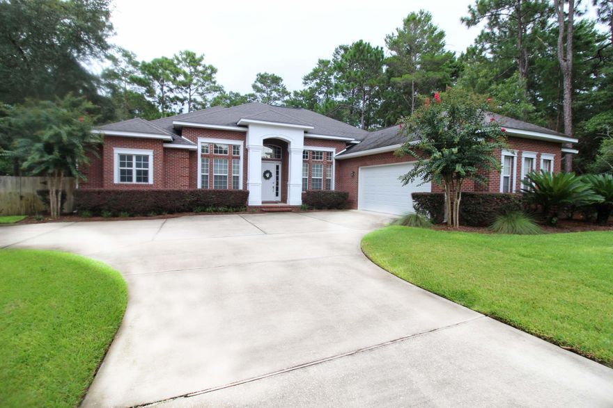 Welcome to Harvest Creek Trail. Nestled on a large lot with expanded drive. As you approach the home. You'll see the double car side entry garage. As you then step through the front door, you'll augh at the 14-15ft ceilings throughout the home. To your right is the formal dining room with double trey 15ft ceiling. To the front of you is the quite family room, featuring a gas fireplace and built-in bookshelves with entry to the back screen porch. The floors are solid oak through-out the foyer, halls, living room and formal dining room. Just off the living room toward the back of the home, you'll find the Kitchen breakfast room and breakfast bar overlooking into the Kitchen which boast; Stainless Steel Appliances matching the Gas Stove and Refrigerator with ice maker. Tall custom cabinetry for plenty of storage, granite countertops, and full-size pantry. Back through the kitchen is the great family room lined with windows to the back yard. On this side of the home are two Bedrooms and full guest bath down the hall. On the opposite of the home is the Master Suite and another guest bedroom and the Full Bath that leads out to the screen porch. The Master Bedroom has two separate walk-in closets. Windows line the back of the room with private entry to the screen porch and Hot-Tub. Out on the screened-in back porch you'll be delighted to sit by the cozy gas fireplace and rest in your hot-tub all the while gazing out over the manicured fenced-in back yard. With just enough trees to provide shade. Back to the house the Utility/Laundry Room is across from the kitchen and leads to the oversize two car garage. Within the garage is a stairway up to the storage room in Attic. Outside is a large expand driveway with a turnaround area and long drive. This one owner home was built by McDorman Construction and all mechanics, roof and appliances are original to the build.