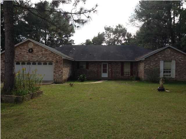 ENJOY COUNTRY LIVING WITH THIS 3 BEDROOM, 2 BATH BRICK HOME. SMALL POND, OUT BUILDING AND ACREAGE FOR YOUR FARM ANIMALS. HOME FEATURES 3 BEDROOMS, MASTER BEDROOM HAS CARPET AND LARGE WALK-IN CLOSET. MASTER BATHROOM HAS A GARDEN TUB, SEPARATE SHOWER, CULTURED MARBLE COUNTER TOP AND VINYL FLOORING. GUEST BEDROOMS HAVE CARPET AND LIVING ROOM HAS A WOOD BURNING FIREPLACE WITH CARPETED FLOORS. KITCHEN HAS PLENTY OF CABINETS, BAR COUNTER TOP AND VINYL FLOORING. LARGE SCREENED IN BACK PORCH TO ENJOY THOSE EVENINGS WITH LIMITED BUGS BOTHERING YOU. SOME HWY FRONTAGE AND PRIVACY OFF OF MITCHELL ROAD AS WELL. HOME IS SOLD ''AS IS''.