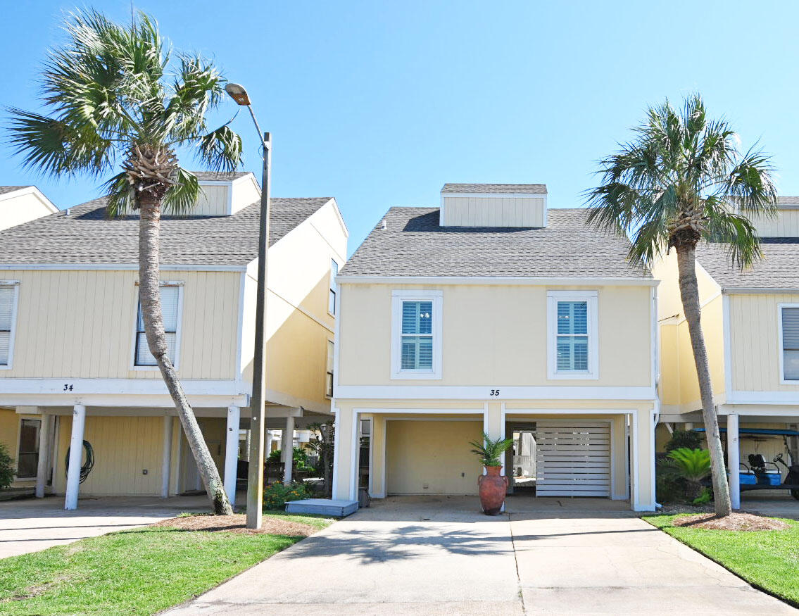 If you are looking for a unique property, then here it is! This two level stand-alone villa is one of only three Sandpiper units featuring an installed elevator, valued at $60,000, providing access to all levels internally and offers unparalleled convenience and functionality. This home also has been up-graded with all new hurricane-impact windows and doors! With three spacious bedrooms and two baths, it is an ideal home to live in or use as a vacation rental investment. The ground floor's outdoor space provides a serene setting for relaxing and entertaining and includes a large storage and laundry room. The first level features an inviting open living room adjacent to the charming wallpapered wall kitchen enhanced with granite countertops and a remodeled pantry off of the dining area.
Two guest rooms and a bathroom complete this level.
The second level makes up the entire Primary suite with a huge walk-in coset that has a twin bed set in place for added sleeping and a double vanity bathroom with granite counter tops. Sandpiper Cove has so many amenities, including 1100 feet of private deeded beach and the newly opened Sand Flea Beach Bar. Beachside there are bathrooms, showers and grills for use which are a huge plus! Residents can enjoy 5 swimming pools (2 are heated in the Winter months) and 3 hot tubs.
There are also many sporting options too like a free nine hole pitch and putt golf course, lit pickle ball and tennis courts, and shuffleboard. For boaters there is an owners boat marina, a boat launch, and a canal with boat slips for rent. The Community Center is available for meetings, parties, and the Snowbirds always have lots of weekly activities planned during the Winter. Additionally, the famous Louisiana Lagniappe Cajun Restaurant offers dining onsite. Come discover the charm of Sandpiper Cove and see why it is such a beloved community.