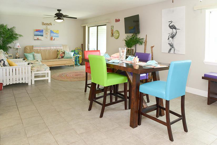 Upscale condo with views of the bay from every room.The artist/owner has made this a truly recognized florida living home.Features include open floor plan. Complex offers a pool, lighted tennis court, laundry facilities & club house with sauna/steam room. Kitchen and bath have been upgraded with granite counters.Two large bedrooms. New carpet in master, ceramic tile throughout the rest. There is always a breeze. High end ceiling fans. Fish from your sea wall or walk across the street to your boat, docked at Shalimar Yacht Basin Marina. If making an offer FHA is not approved, Conventional w/20%. With full price offer, owner will pay 2 months HOA dues. Furniture or ''turn key'' negotiable. Home Warranty to convey.