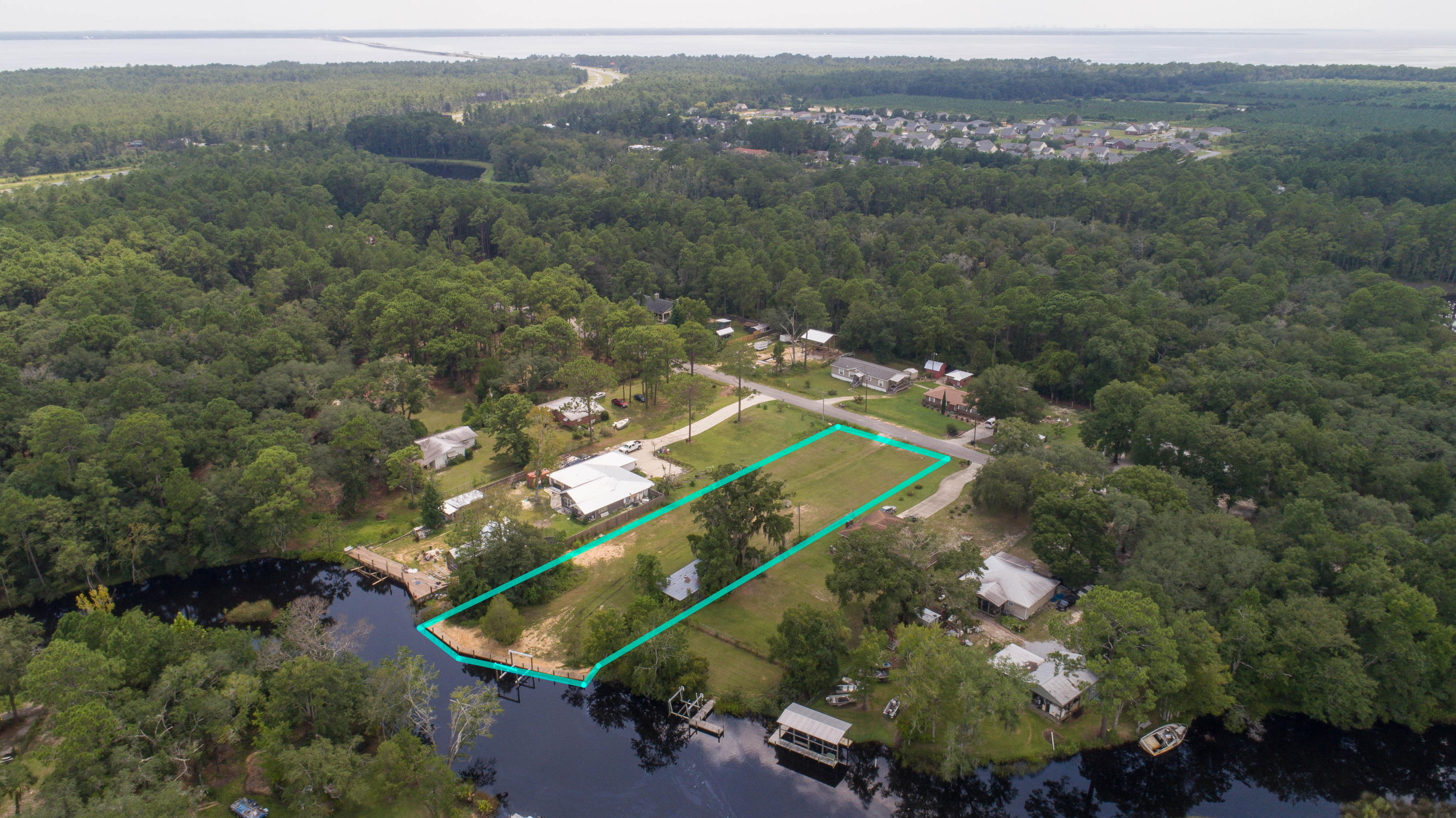 Large waterfront lot on historic, Mallet Bayou. Perfect home site and ready to build. Seller just installed a sea wall and a high end boat lift. Property comes with original out building and is located south of Hwy. 20. Listing agent will gladly show this property by boat with proper scheduling. This lot is what the locals call ''true bayou living''. Mallet bayou leads to the bay and is very close to the Freeport Marina and yacht club.