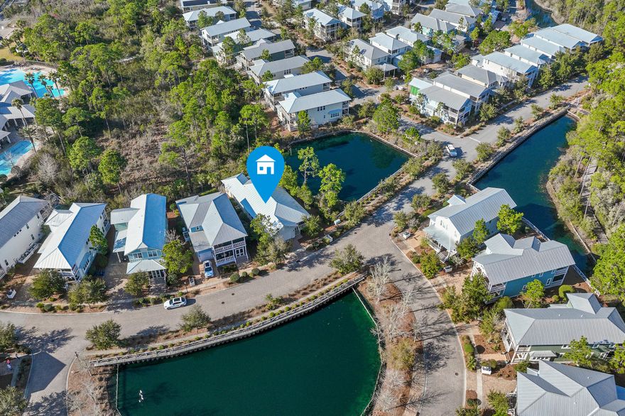 Experience the refined coastal lifestyle of 30A in this beautifully furnished Beachwind floorplan, a rare single-story residence ideally positioned on a premium corner homesite overlooking pond views and protected preserve, offering exceptional privacy and peaceful natural surroundings. Located south of Highway 98 in the highly coveted community of NatureWalk at Seagrove, this immaculate never-rented home is just a short stroll to the community's resort-style pool, amenities and within a mile of the renowned sugar-white sand beaches of the Emerald Coast.Enhancing the coastal lifestyle, the home includes a six-seater golf cart, perfect for effortless rides along Scenic Highway 30A to nearby cafes, boutiques, coastal destinations such as Seaside and Watercolor. Rarely available within the community, this thoughtfully designed single-level home with a desirable two-car garage is offered fully furnished and turnkey, featuring three spacious bedrooms, two-and-a-half baths, and 1,863 square feet of beautifully curated living space.  The layout seamlessly blends elegance, comfort, and privacy in one of 30A's most desirable communities.
The open-concept design blends timeless coastal elegance with everyday comfort.  At the heart of the home is a stunning chef's kitchen showcasing stainless steel appliances, a GE gas cooktop, and a generous granite island with seating for four, ideal for entertaining and gathering with family and friends. Coastal character is showcased through shiplap accents and hardwood floors throughout the home, creating a warm and sophisticated atmosphere.

The inviting living room features hardwood floors, recessed lighting, and a beautiful fireplace with mantle and mounted television. A wall of windows fills the space with abundant natural light while framing tranquil wooded preserve views, creating a bright and relaxing setting perfect for both everyday living and hosting guests.

Privately situated at the rear of the home, the spacious primary suite serves as a peaceful retreat, complete with hardwood floors throughout, a tray ceiling with recessed lighting, and large windows that bring in natural light. The ensuite bath offers dual vanities, a walk-in shower, private water closet, and a generously sized professionally designed walk-in closet.

Additional notable features include a Culligan whole-house water softener system, HVAC installed in 2025, and the convenience of the attached two-car garage, providing ample storage and parking.

Residents of NatureWalk at Seagrove enjoy an amenity-rich lifestyle designed to celebrate the area's natural beauty. Scenic nature trails wind throughout the community and connect directly to the beach, while The Gathering Place offers a heated lap pool, zero-entry pool, hot tub, fire pit, grills, bar area, outdoor TVs, playground, and ample gathering spaces. The community also features fitness stations, multi-purpose courts, and pickleball courts.

Ideally located just off Scenic Highway 30A and adjacent to WaterColor Publix, the community offers easy access to beloved coastal areas including Seaside, WaterColor, and Seagrove Beach, to some of the finest dining, boutiques, and beach experiences along 30A.

Whether you are searching for a primary residence, second home, or investment property, this rare one-story offering presents an exceptional opportunity to enjoy the relaxed elegance of the 30A coastal lifestyle in NatureWalk at Seagrove.
