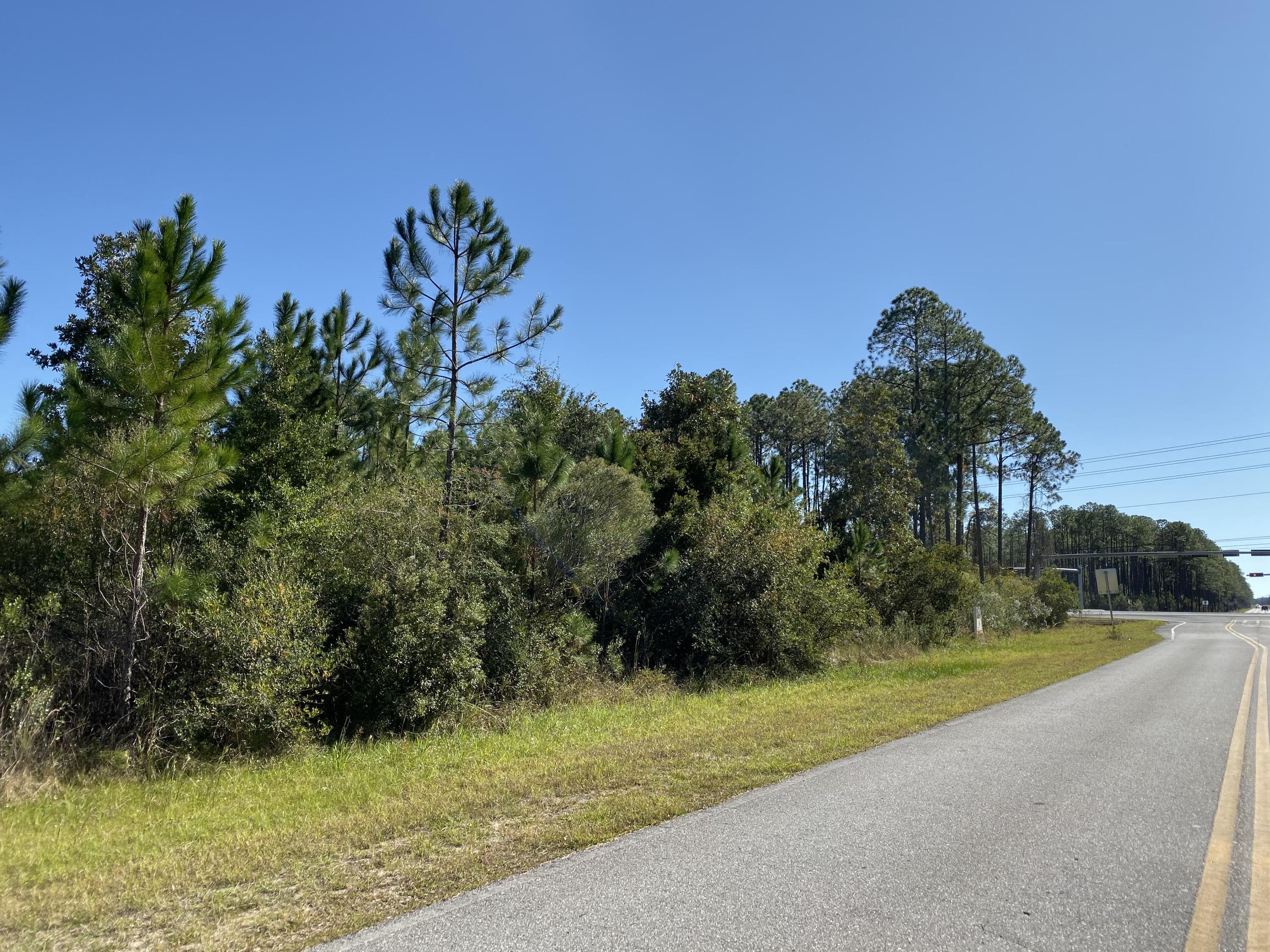 This land is zoned Town Center One. A potential for commercial property 30 feet from Hwy 98.