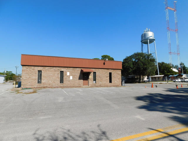 Freestanding 8262 SF office building located in Valparaiso within 10 minute drive to Eglin AFB east gate. 12 large windowed executive offices, tremendous built-in cubicle work spaces, large & small conference rooms, restrooms, kitchen / break area and over 50 parking spaces. The building is equipped with fiber optics, back-up gas generator, lab area, security systems, magnetic locks on exterior doors and 8 HVAC units. This building was designed with the defense contractor in mind. This property is also for lease at $8/SF Triple Net. 5 year lease or longer would be considered.