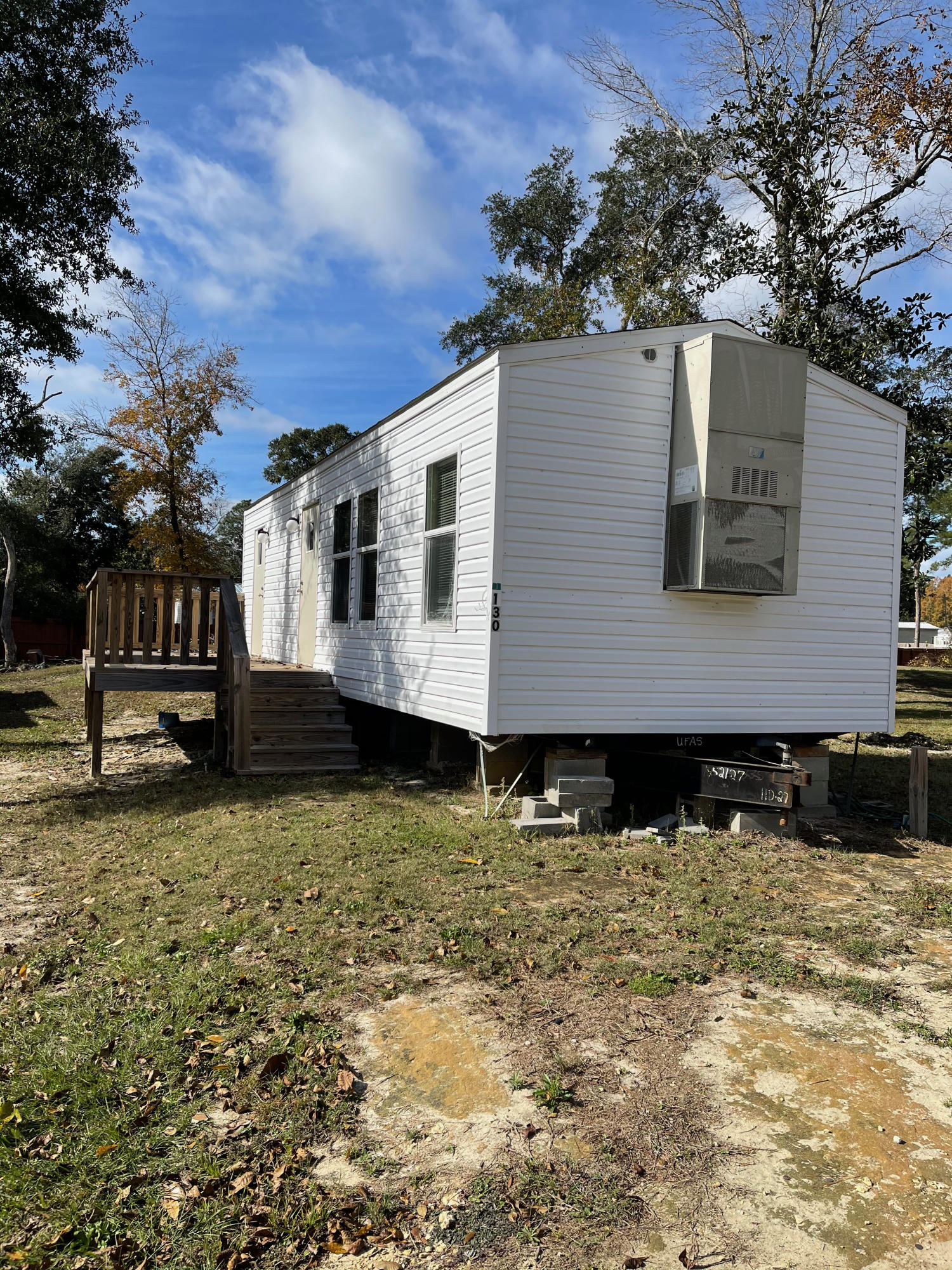 One of the four is currently under contract to sell 1/14/21. The updated price is $240K for three remaining properties. AFFORDABLE HOUSING OPPORTUNITY! INVESTORS ALERT! This property HAS 3 rental properties providing the owners $900 per month per unit or $2700 total on the existing one bedroom one bath mobile homes.  This could be a great opportunity for a builder to build 3 spec homes to resale or simply keep the property as is and take advantage of the $32,400 in gross annual rental income.  The sellers have a property manager in place and waiting list on the rentals.  Three 1/4 acre lots can be used as individual home sites or one larger property to build your dream home.