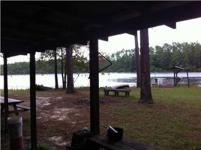 82.56 +/- Acres. Wow! This water front home site or quiet country get away has a small rustic cabin on a beautiful lake! Big Oaks and mature planted pines .The pines are ready to cut or use for your timberland tax reduction, call your tax collector for details. Bring your fishing boat, house plans, your deer stand, horses and cows! The Whippoorwill's still sing, and crickets chirp from here. You can see the stars from this piece of God's creation! Seller will divide multiple ways see additional mls listings. Mineral Rights do not convey. Shown By Appointment only Hunting lease in effect.
