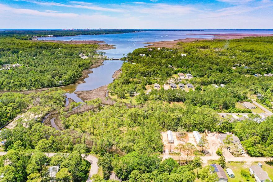 This peaceful wooded lot sits just south of Choctawhatchee Bay in close proximity to Cessna Landing where there's a public boat launch, a playground and picnic area. Santa Pine Street is located in the heart of Santa Rosa Beach in a neighborhood without the overhead of an HOA. This wooded lot provides the opportunity to build the perfect full-time residence or long-term rental investment property with easy access to boating, fishing, shopping and dining along with the beautiful beaches of South Walton.