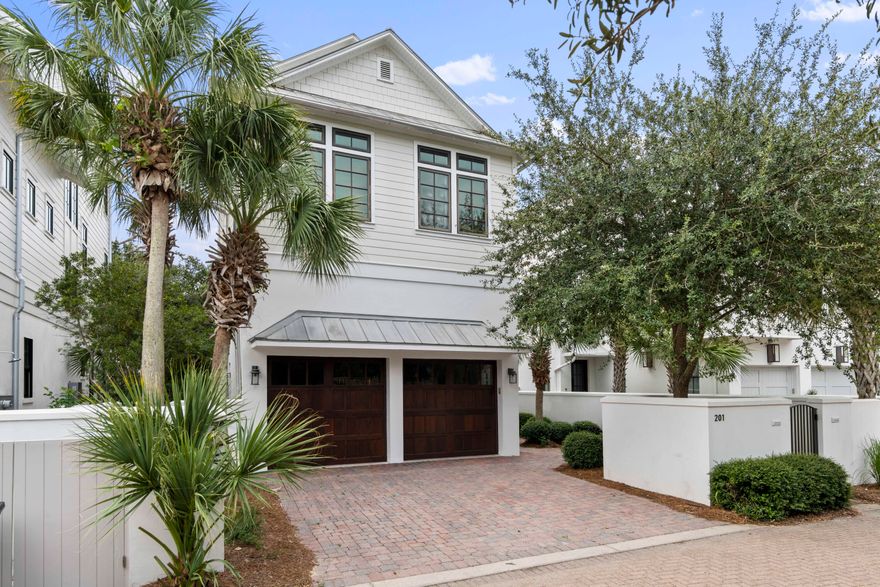 Located in the heart of Seagrove, this captivating home is perfectly nestled behind the gates of Seanest Village. Enjoy the convenience of the resort style pool along with deeded beach access in short proximity. This Gulf view home features 2 en-suite bed/baths on the main level in addition to the 2 car garage. The second level boasts a generous living, kitchen, and dining area that is perfect for hosting gatherings and features high-end Viking kitchen appliances. In addition to the living area,  covered porch, and powder room, the 2nd level also has an oversized master suite with vaulted wood ceilings. Upstairs you will find an additional en-suite bedroom/bath and a kitchenette that both lead out to the balcony with gulf views! Seanest offers a highly desirable Seagrove location in close proximity to Eastern Lake, 30A restaurants, Greenway Station, and Seaside.